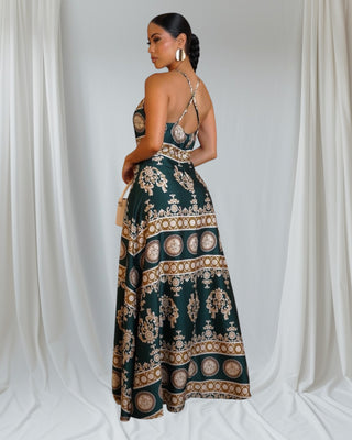 Golden Aura Maxi Dress — emerald halter maxi with gold baroque print — Tulley’s Boutique.