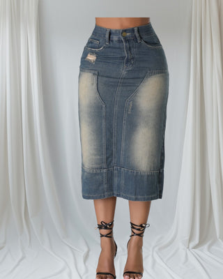Woman wearing vintage wash high-waisted denim midi skirt with front fading — Tulley’s Boutique