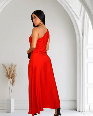 Model wearing red Touch of Elegance Maxi Dress with asymmetrical neckline and full-length skirt