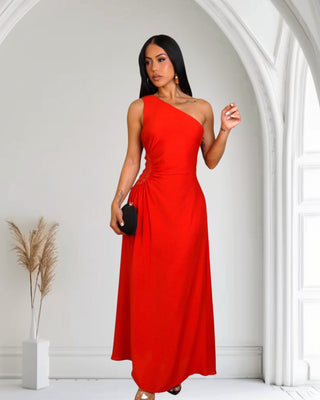 Model wearing red Touch of Elegance Maxi Dress with asymmetrical neckline and full-length skirt