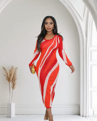 Model wearing the Ebony Glam Bodycon Midi Dress with orange stripes, ideal for stylish evening occasions.
