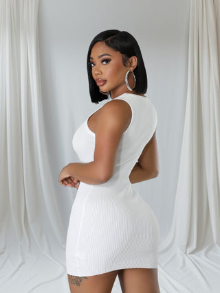 Woman wearing white ribbed sleeveless bodycon mini dress with metal accent — Tulley’s Boutique