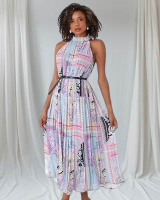 flowy pastel halter neck maxi dress showing sleeveless design and pleated silhouette — Tulley’s Boutique