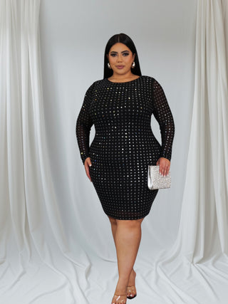 Plus-size woman wearing black long-sleeve sequin evening dress with round neckline — Tulley’s Boutique