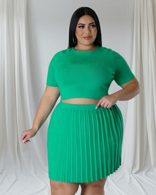 green matching skirt set showing high-waisted fit and flattering silhouette.