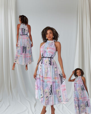 flowy pastel halter neck maxi dress showing sleeveless design and pleated silhouette — Tulley’s Boutique