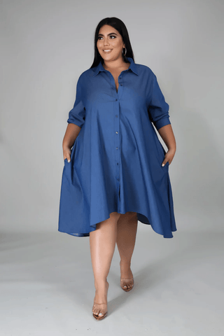 Plus size model wearing an elegant midi dress from Tulley’s Boutique — chic, curve-flattering design for confident women.