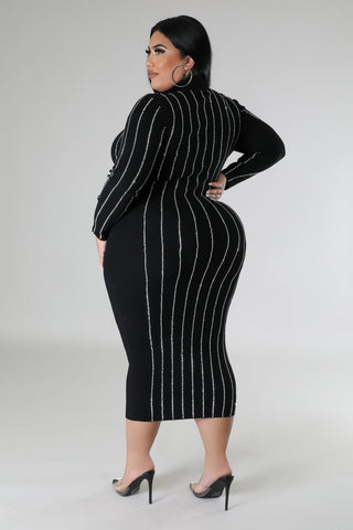 Model wearing plus-size black rhinestone bodycon midi dress with long sleeves and turtleneck