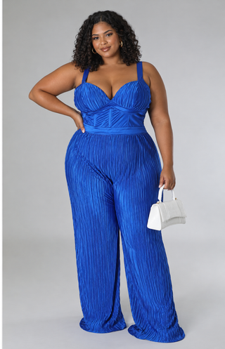 Plus size model wearing the Elegant royal blue satin wide-leg jumpsuit with pleated sweetheart bust, adjustable straps, and defined waist, front view