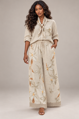 Full-length front view of the cream floral linen set with scarf, side pockets and frayed fringe hem wide-leg pants
