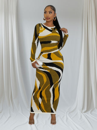 Model wearing the Gold Swirl Pattern Bodycon Dress, showcasing its elegant design and vibrant colors.