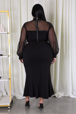 Elegant Essence Mesh Two - Piece - Model wearing plus-size black mesh two-piece skirt set with sheer sleeves and mock neckline