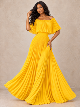 Front view: Woman in a yellow off-the-shoulder pleated maxi dress with flutter neckline and smocked waist, skirt swirling
