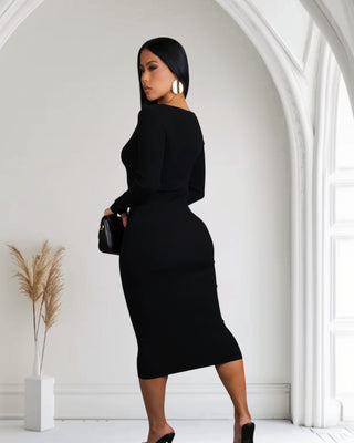 A chic black sweater midi dress with a V-neck and long sleeves, designed for a stylish and comfortable look in cooler weather.