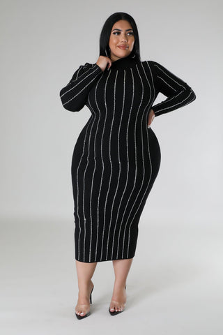 Model wearing plus-size black rhinestone bodycon midi dress with long sleeves and turtleneck