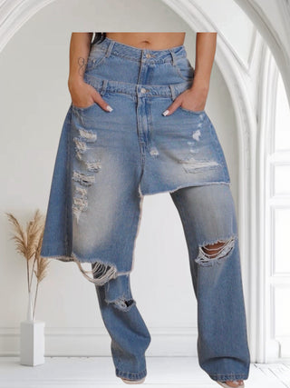 Person wearing a pair of distressed blue jeans. High fashion double layer