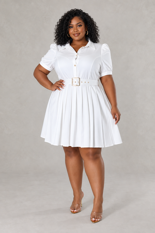 - Plus\-size woman wearing a white collared button\-front pleated belted mini dress, front view