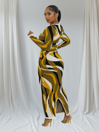Model wearing the Gold Swirl Pattern Bodycon Dress, showcasing its elegant design and vibrant colors.