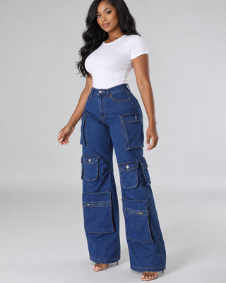 Model in Boss Move high-waisted blue cargo wide-leg jeans with a white tee and heels, three-quarter angle
