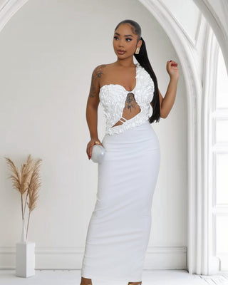 Elegant White One-Shoulder Ruffle Cutout Gown, featuring ruffle detailing, a stylish cutout at midriff, and a sultry side slit
