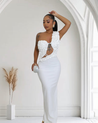 Elegant White One-Shoulder Ruffle Cutout Gown, featuring ruffle detailing, a stylish cutout at midriff, and a sultry side slit