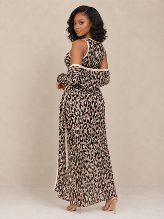 Petite woman wearing leopard print bodycon dress with long open-front cardigan - back view