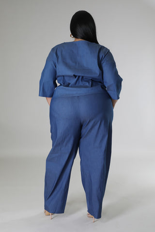 Person wearing a blue outfit on a plain background