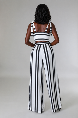Back view of black and white petite striped crop top and wide-leg pants set