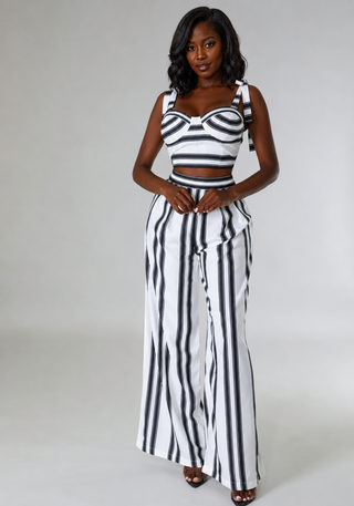 Styled front view of petite striped set with tie-shoulder crop top and high-waisted pants
