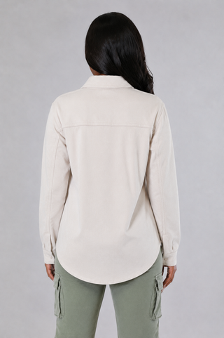 Cream suede-feel utility shirt with a structured collar, button front and functional chest pockets.