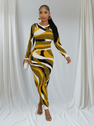 Model wearing the Gold Swirl Pattern Bodycon Dress, showcasing its elegant design and vibrant colors.