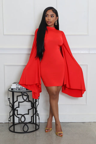 Model wearing Red Sun stretch mini dress with round neckline and extra long bell sleeves