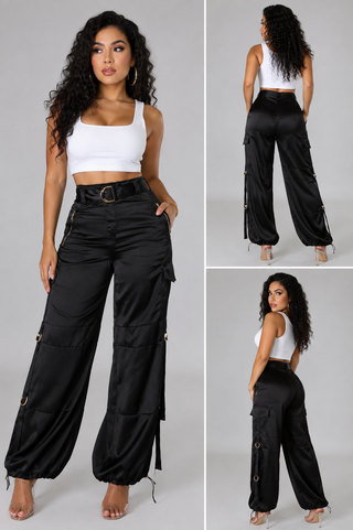 Front view of women’s high-waisted black cargo pants featuring D-ring belt and functional utility pockets