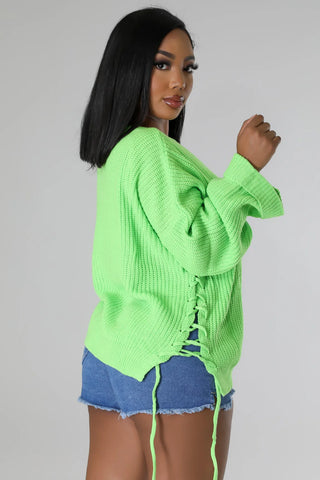 Boutique cozy sweater with self tie strap closure