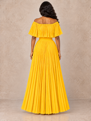 Back view of a yellow pleated off-the-shoulder maxi dress showing the smocked waist and full skirt