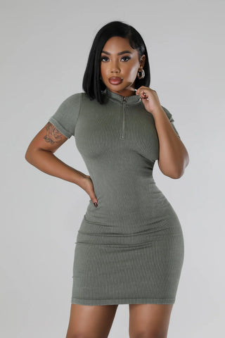Model wearing olive mock neck zip front stretch mini dress