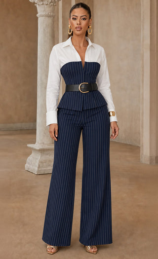 Front view of a white and navy pinstripe peplum top with matching wide-leg pinstripe pants, styled with a black belt.