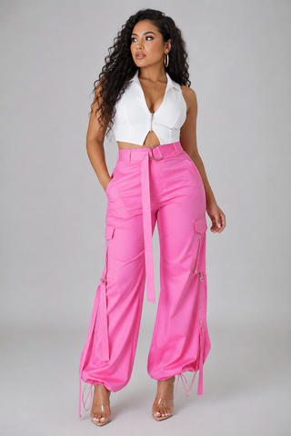 Front view of women’s high-waisted pink cargo pants featuring D-ring belt and functional utility pockets