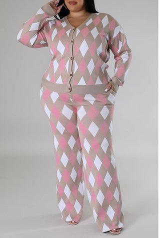 Plus-size woman wearing a pink, white, and beige geometric diamond-patterned knit cardigan and matching wide-leg pants loungewear set.