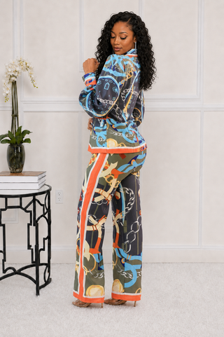  Three-quarter view of petite charcoal and orange printed blazer pants set