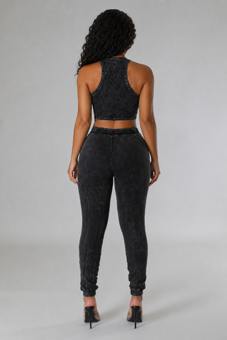 Back view of a charcoal acid wash jogger set with a ribbed racerback crop top and elastic\-waist pants\.