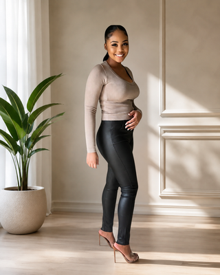 Black high-waist leather-look skinny pants styled with nude heels
