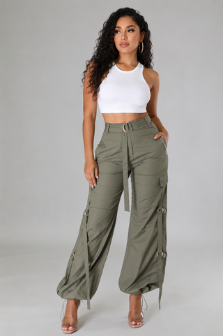 Women’s olive cargo pants with high waist, D-ring belt, utility pockets and adjustable ankle details