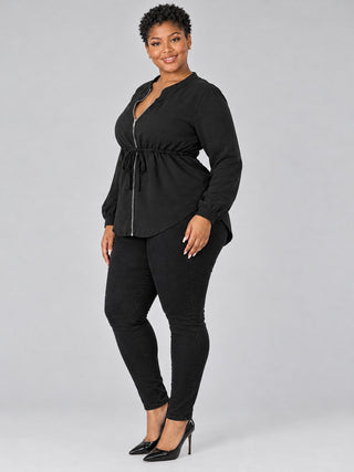 Side view of plus size black tie-waist blouse showing the cinched drawstring waist and curved peplum hem