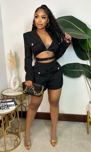 black blazer romper with cutout front and gold button details
