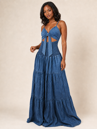 Blue acid wash denim jumpsuit with the front ties styled open and untied