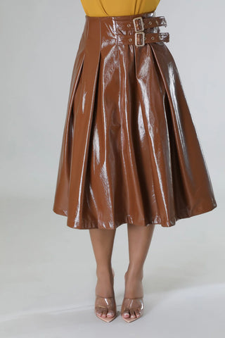 Brown glossy faux leather pleated midi skirt with double buckle waist detail