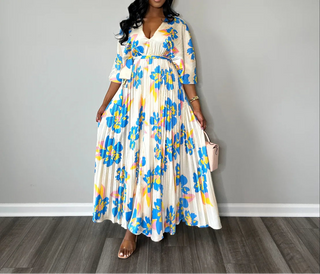 Pleated ivory maxi dress with vibrant blue flowers