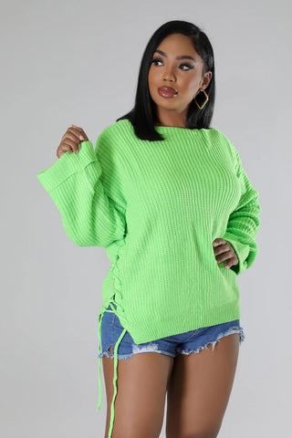 Boutique cozy sweater with self tie strap closure