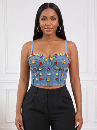 Close-up of The Jewel Drip denim corset top on a model showing the sweetheart neckline, seamed cups and red, yellow, green and purple gem details